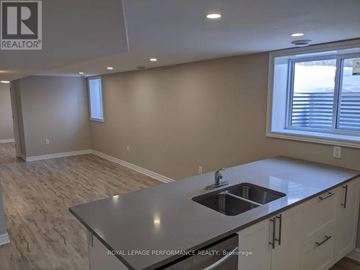 Ottawa apartment for rent - A kitchen with a sink and a window.