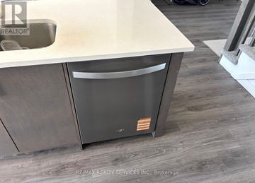 Cambridge townhouse for rent - A modern kitchen with a dishwasher and a sink.