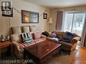 Waterloo apartment for rent - A living room with a couch, coffee table, and a lamp.