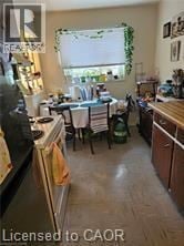 Waterloo apartment for rent - A kitchen with a table and chairs by a window.