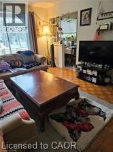 Waterloo apartment for rent - A living room with a couch, coffee table, and a rug.