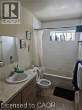 Waterloo apartment for rent - A bathroom with a sink, toilet and bathtub.