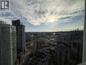 New Westminster apartment for rent - A cityscape with a sunset in the background.