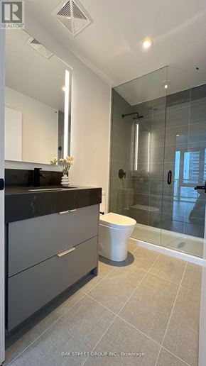 Toronto (Church-Yonge Corridor) condo for rent - A modern bathroom with a walk-in shower and a toilet.