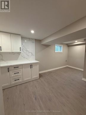 Mississauga (Rathwood) apartment for rent - A room with white cabinets and a marble countertop.