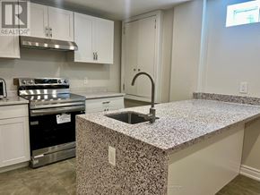 Richmond Hill (Westbrook) apartment for rent - A kitchen with a granite countertop and stainless steel appliances.