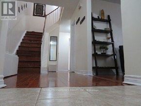 Ajax (Central) apartment for rent - A hallway with a staircase and a ladder.