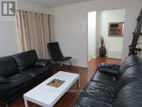 Ajax (Central) apartment for rent - A staircase with a metal railing and a sign that says REALTOR.