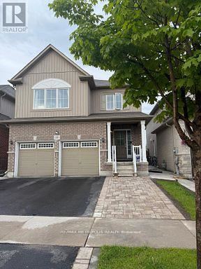 Oshawa (Eastdale) apartment for rent - A two-story house with a garage is shown in the image.