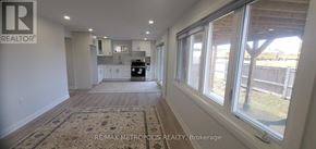 Georgina (Keswick South) apartment for rent - A realtor's office with a large window overlooking a backyard.