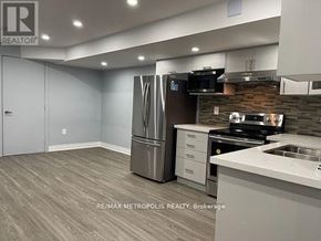 Markham (Cornell) apartment for rent - A kitchen with a refrigerator, stove, and microwave.