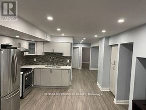 Markham (Cornell) apartment for rent - A kitchen with a refrigerator, sink, and cabinets.