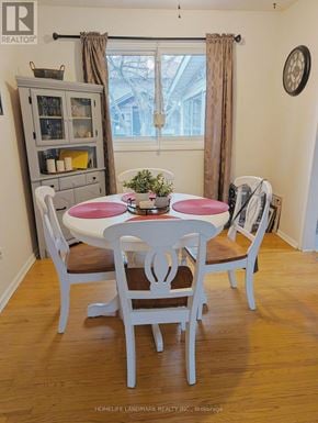 Hamilton (Berrisfield) apartment for rent - A dining room with a white table and chairs.