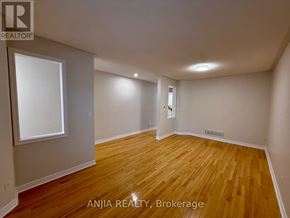 Markham (Greensborough) apartment for rent - A room with wooden flooring and white walls, with a window on the left wall.