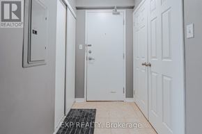 Clarington (Bowmanville) condo for rent - A hallway with a door on the left and a door on the right.