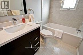 Richmond Hill (Crosby) apartment for rent - A bathroom with a white sink, toilet, and bathtub.
