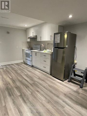 Newmarket (Stonehaven-Wyndham) apartment for rent - A kitchen with a refrigerator, dishwasher, and oven.
