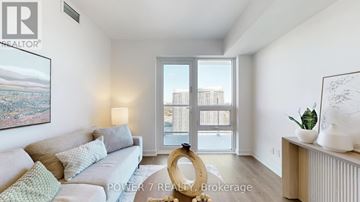 Toronto (Agincourt South-Malvern West) condo for rent - A living room with a grey couch and a large window.
