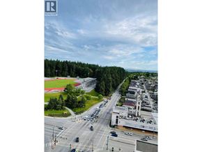 Vancouver apartment for rent - A view of a street with cars and buildings from a high angle.