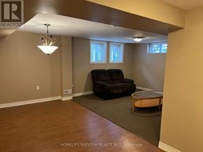 Aurora (Aurora Heights) apartment for rent - A living room with a black couch and a wooden coffee table.