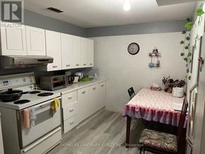 Hamilton (Ainslie Wood) apartment for rent - A small kitchen with a table and chairs.