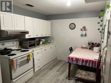 Hamilton (Ainslie Wood) apartment for rent - A small kitchen with a table and chairs.