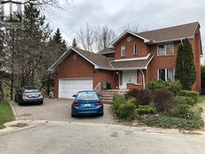 Hamilton (Ainslie Wood) apartment for rent - A house with a car parked in front of it.