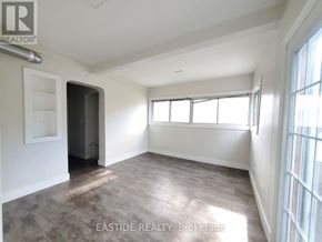 Toronto (Danforth) apartment for rent - A room with a door and a window is for sale.