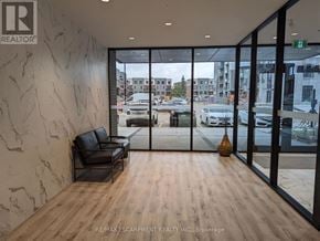 Waterloo condo for rent - A waiting area with a view of the street outside.