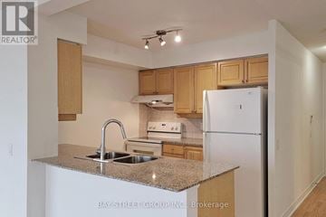 Toronto (Bendale) condo for rent - A kitchen with a sink, stove and refrigerator.