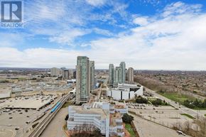 Toronto (Bendale) condo for rent - A real estate company logo is superimposed on an aerial view of a cityscape.