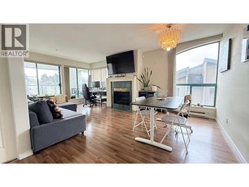 Vancouver apartment for rent - A living room with a grey couch and a white table.