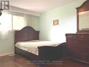 Toronto (Bayview Woods-Steeles) apartment for rent - A bedroom with a bed, dresser, and mirror.