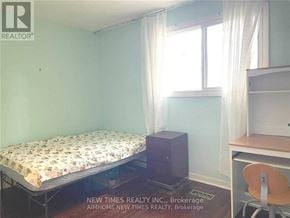 Toronto (Bayview Woods-Steeles) apartment for rent - A bedroom with a bed, desk, and chair.