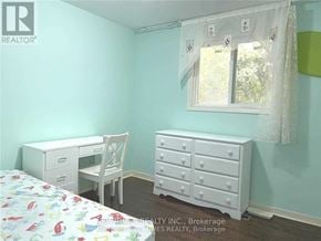 Toronto (Bayview Woods-Steeles) apartment for rent - A bedroom with a bed, desk, and dresser.