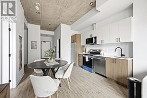 Ottawa condo for rent - A modern kitchen with a dining table and chairs.