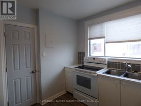 Ottawa apartment for rent - A kitchen with a stove, oven, and sink.