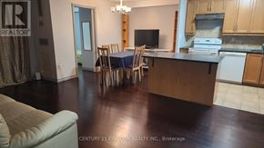 Toronto (Flemingdon Park) condo for rent - A kitchen with a dining table and chairs.