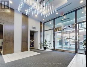 Toronto (Mimico) condo for rent - A foyer with a glass door entrance and a plant in a pot.