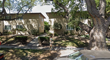Glendale apartment for rent - A tree is in front of a building.