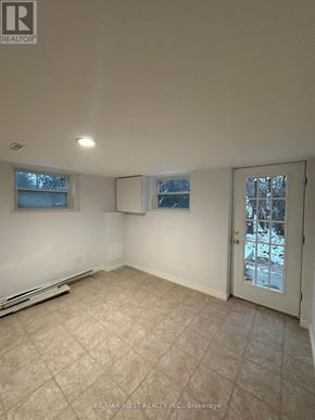 Toronto (Highland Creek) apartment for rent - A room with a door, a window, and a tiled floor.