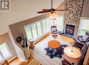 Georgian Bay (Baxter) apartment for rent - A living room with a fan, a couch, and a table.