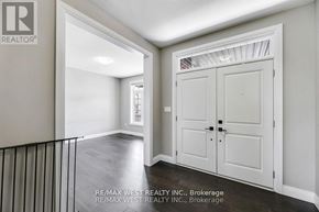 Thames Centre apartment for rent - A real estate image of a room with a white door and a window.