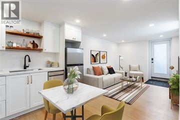 Hamilton apartment for rent - A modern kitchen with a dining table and chairs.
