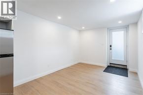 Hamilton apartment for rent - A room with a door and a mat on the floor.