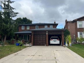 Vaughan (Glen Shields) apartment for rent - A house with a car in the garage.