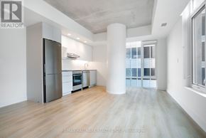 Ottawa condo for rent - A spacious kitchen with a refrigerator, oven, and sink.