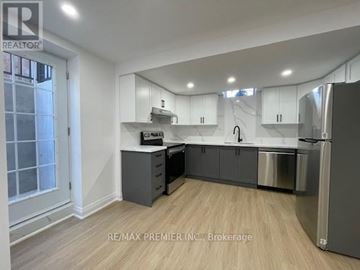 Vaughan (Vellore Village) apartment for rent - A kitchen with white cabinets and a refrigerator.