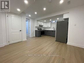 Vaughan (Vellore Village) apartment for rent - A spacious room with a kitchenette and a refrigerator.