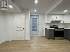 Vaughan (Vellore Village) apartment for rent - A kitchen area with a stove, oven, and cabinets.
